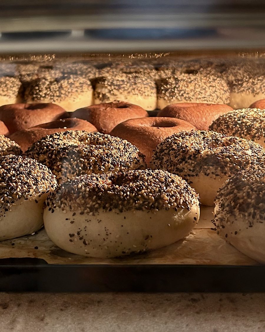 Trays of freshly baked bagels in the oven